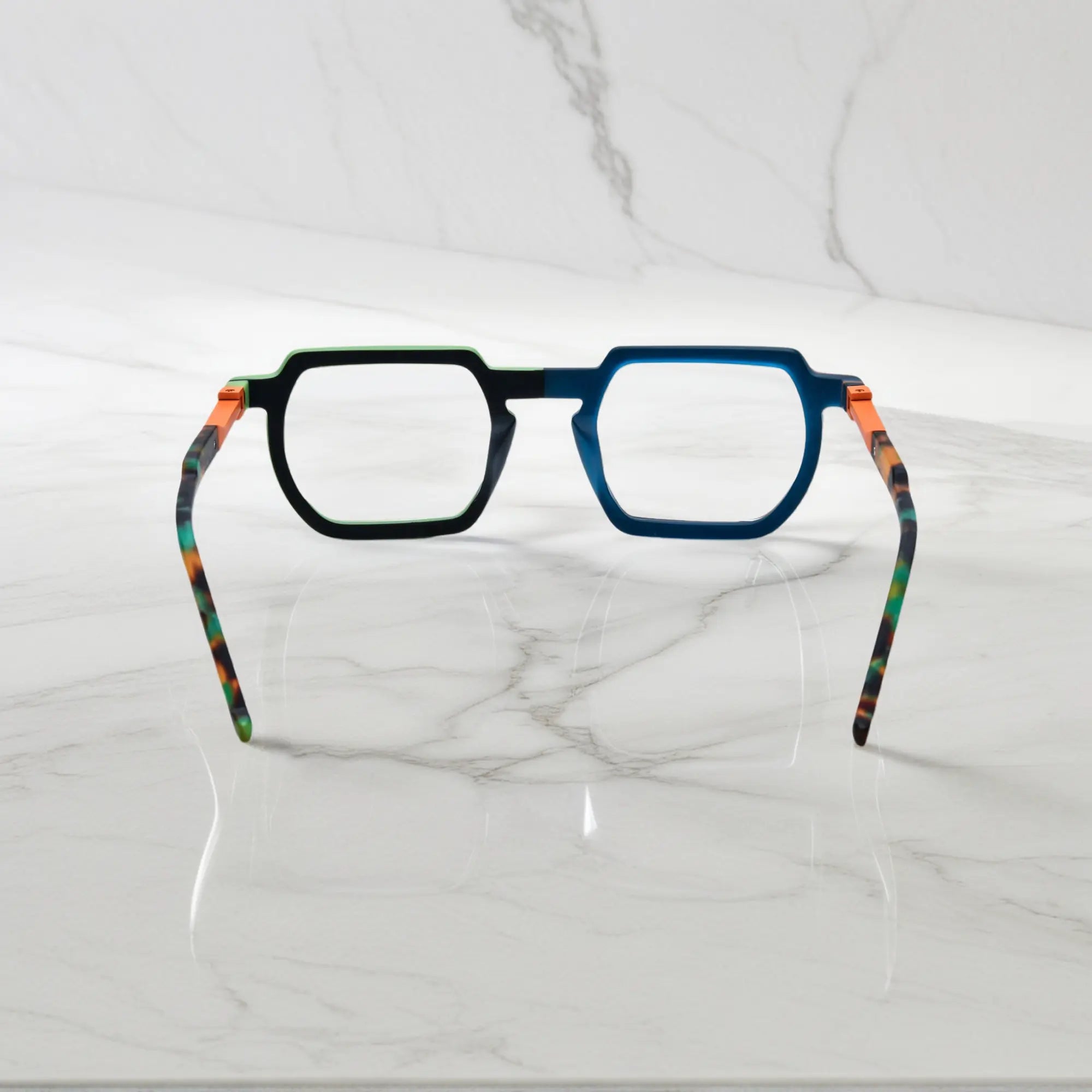 Rear view of bold Blue-Green Matte acetate frames with spring hinges and smooth finish